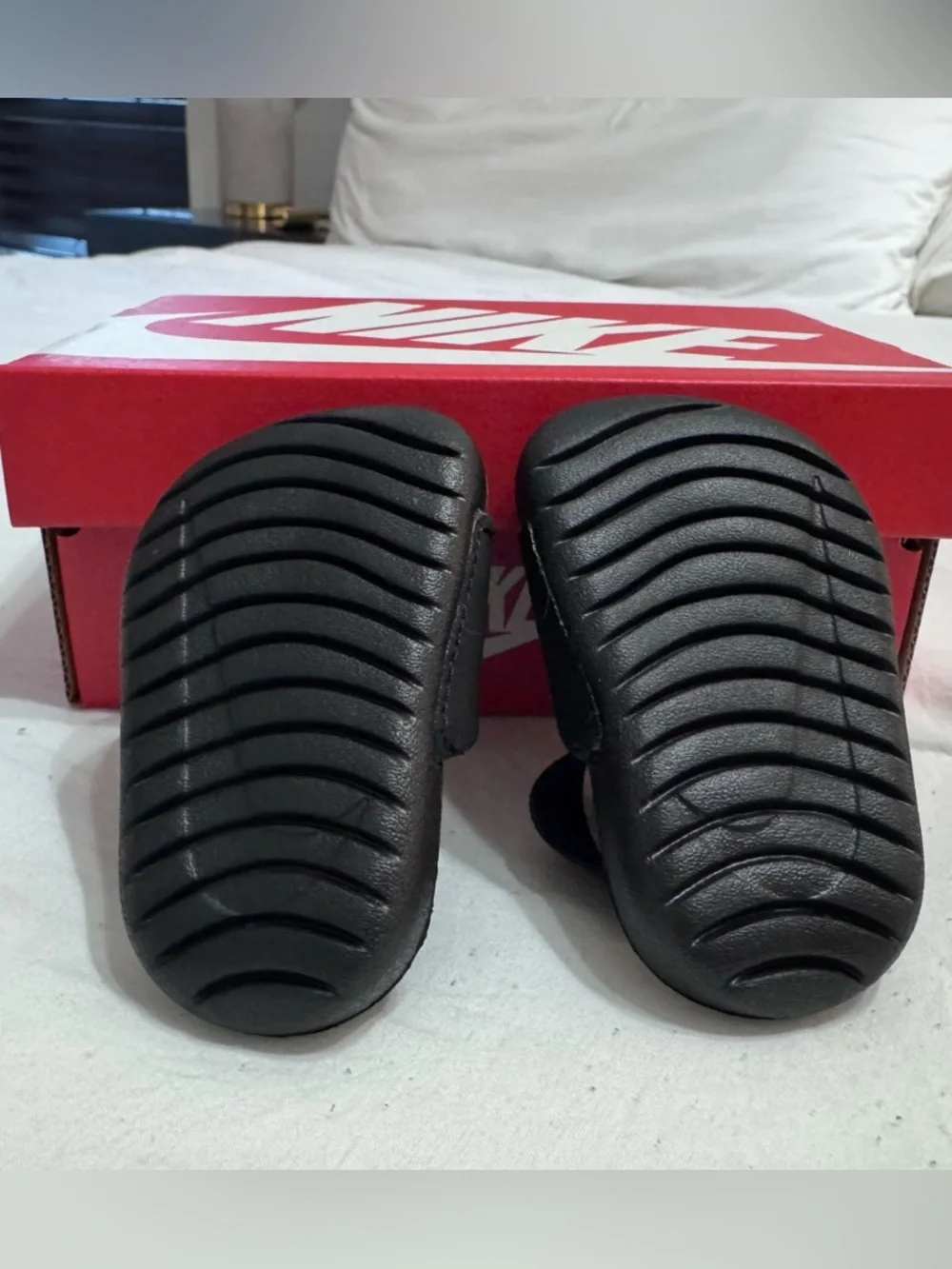 Nike Infant Black Slide Sandals with Gold Swoosh